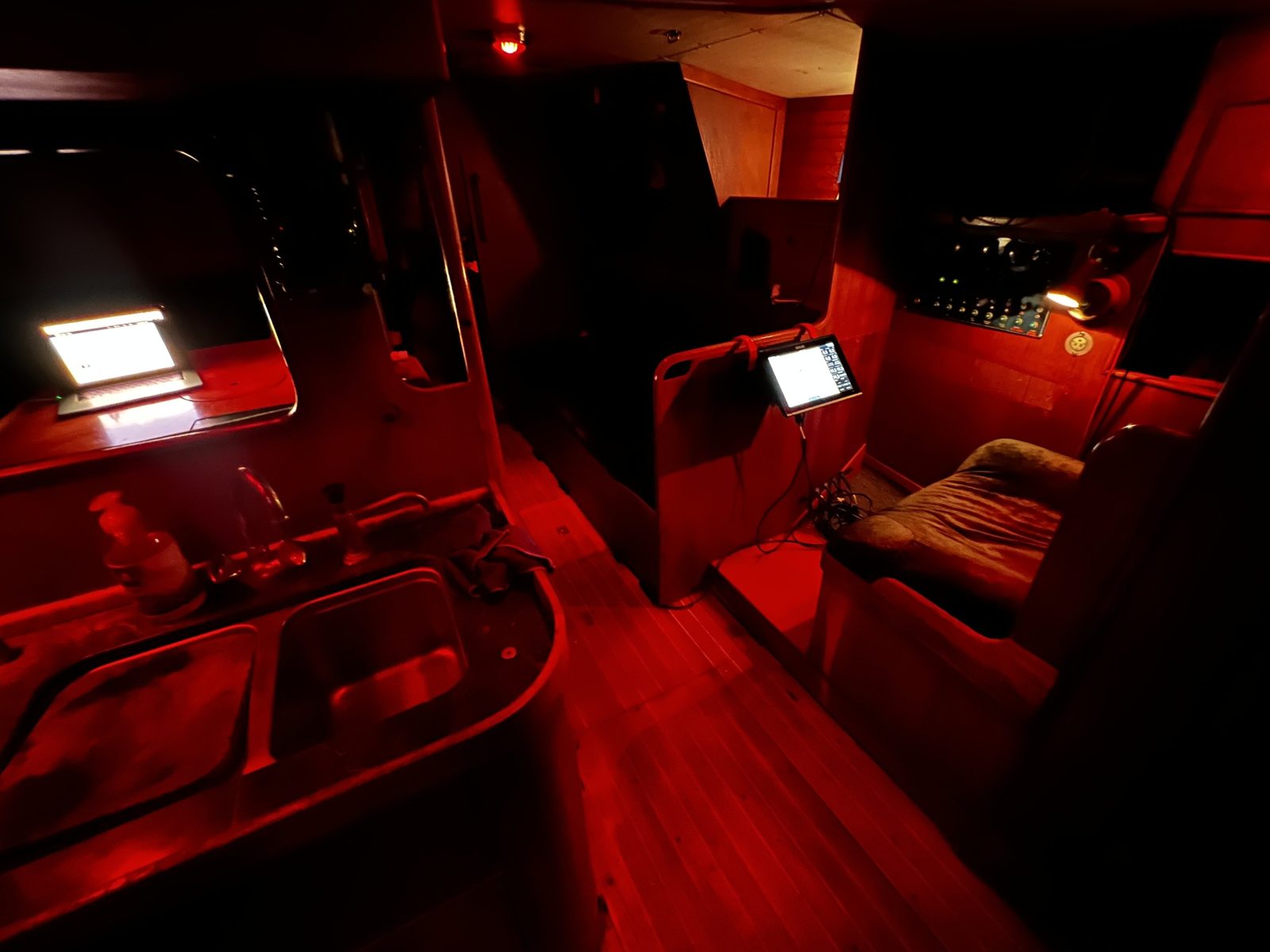 The cabin under red night lighting on passage