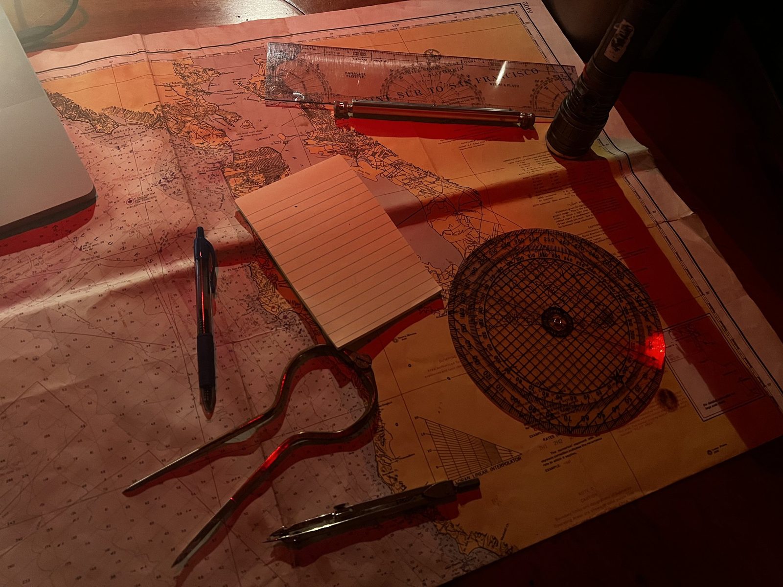 The nav station - a paper chart, dividers and parallel rule
